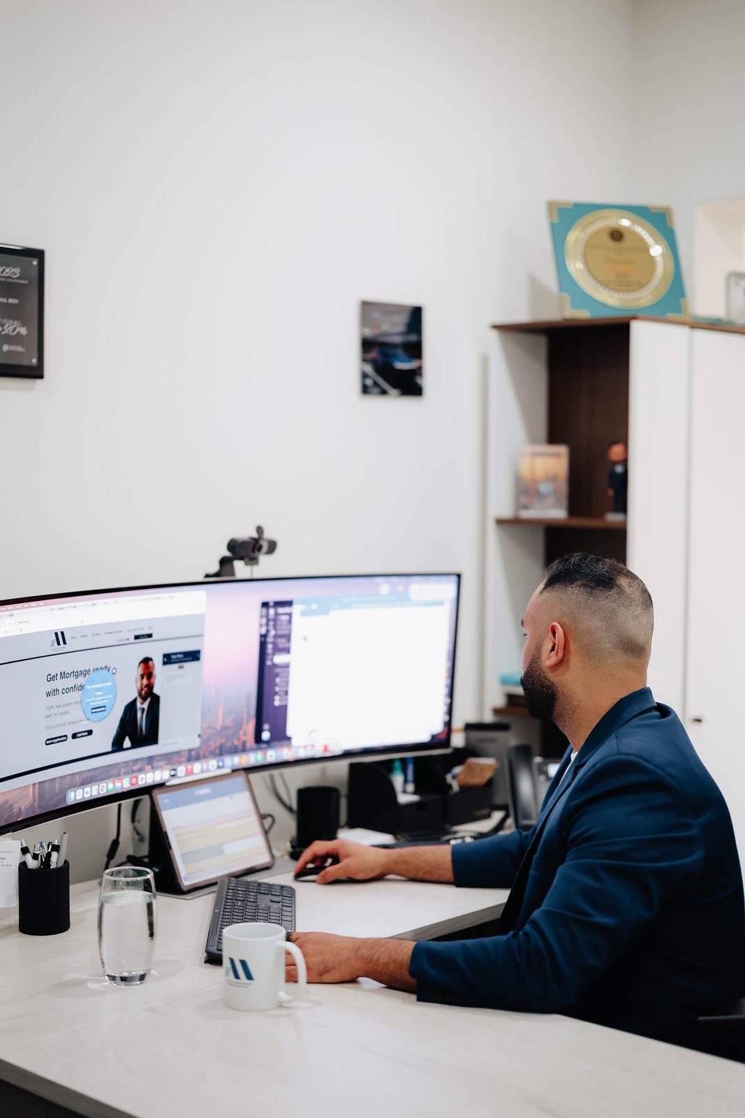 Rahul Bedi working at his desk in the Bedford office