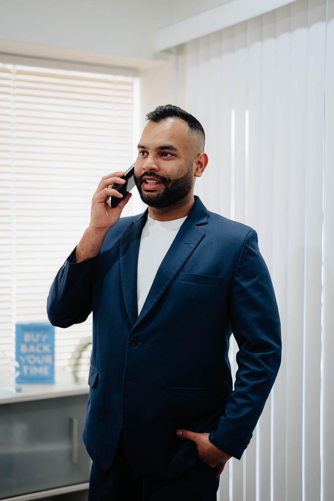 Rahul Bedi on a phone call in the Team Active Mortgage office